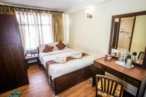 Ένα ή περισσότερα κρεβάτια σε δωμάτιο στο Hotel Yambu kathmandu