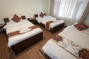 Ένα ή περισσότερα κρεβάτια σε δωμάτιο στο Hotel Yambu kathmandu