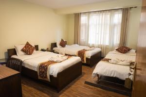 Ένα ή περισσότερα κρεβάτια σε δωμάτιο στο Hotel Yambu kathmandu