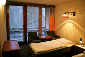 Łóżko lub łóżka w pokoju w obiekcie Hotel Medlov Depandance
