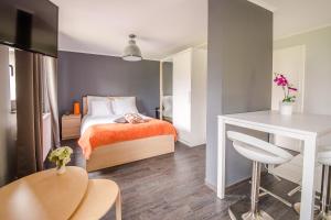 Cama o camas de una habitación en Mandarina Hotel Luxembourg Strassen