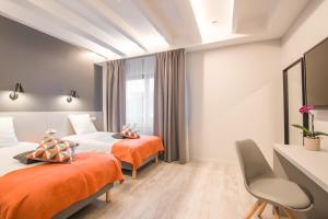Cama o camas de una habitación en Mandarina Hotel Luxembourg Strassen