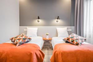 Cama o camas de una habitación en Mandarina Hotel Luxembourg Strassen