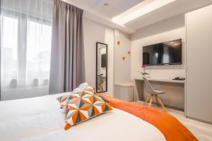 Cama o camas de una habitación en Mandarina Hotel Luxembourg Strassen