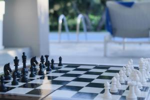 a chess board on a table in a yard at Villa Felenia - Private Pool in Vryses