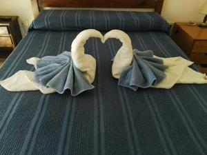 En eller flere senge i et værelse på Hotel Zingaro