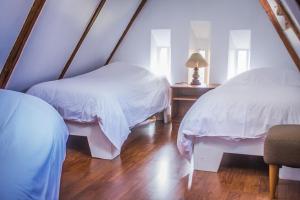 Letto o letti in una camera di Hostal Posada del Maple