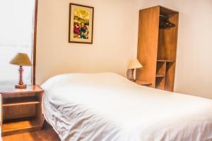 Letto o letti in una camera di Hostal Posada del Maple