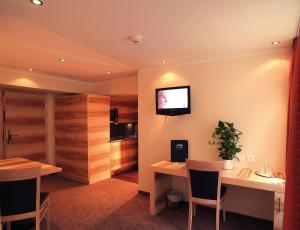TV a/nebo společenská místnost v ubytování Hotel Garni Muttler Alpinresort & Spa