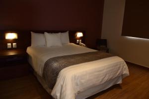 Voodi või voodid majutusasutuse Lithio Hotel toas
