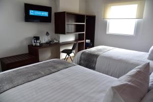 Voodi või voodid majutusasutuse Lithio Hotel toas