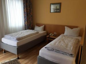 Postel nebo postele na pokoji v ubytování Hotel Kull von Schmidsfelden