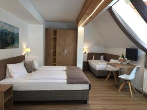 Postel nebo postele na pokoji v ubytování Hotel Restaurant Platzer