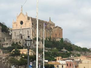a church on the side of a mountain at Almayer Noemi in Gaeta