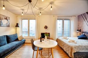 Posteľ alebo postele v izbe v ubytovaní Tartaczna Deluxe Apartments Gdansk