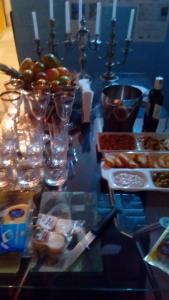 a table with a bunch of food on it at Mini Hostel Fine Art in Vitória da Conquista