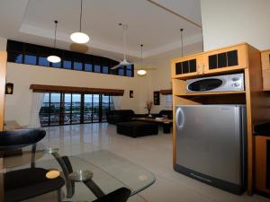 a large living room with a kitchen and a living room at Royal Park Apartments in Jomtien Beach