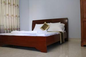 Ένα ή περισσότερα κρεβάτια σε δωμάτιο στο Homestay Vũng Tàu