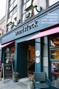 a wood shop with a sign in front of it at Cosy Home; Sleeps 10/11. City 15 minutes’ walk in Dublin