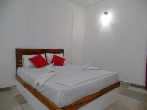 Postel nebo postele na pokoji v ubytování Amaya River Side Homestay