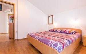 Postel nebo postele na pokoji v ubytování Apartments Lucija 2