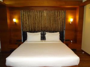 Postel nebo postele na pokoji v ubytování Hotel Cosmopolitan