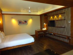 Postel nebo postele na pokoji v ubytování Hotel Cosmopolitan