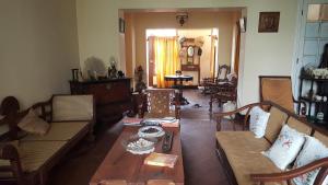 a living room with couches and a coffee table at Beatrice House Galle Fort - Homestay in Galle