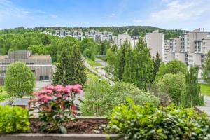a view of a city with trees and buildings at Private Room Gransdalen in Oslo