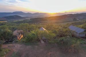 an aerial view of a house with the sunset in the background at Muluwa Lodge in White River