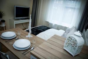 โทรทัศน์และ/หรือระบบความบันเทิงของ Amazing Apartment, City Centre, Modern, Elegant, Cozy