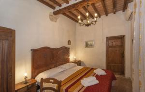 a bedroom with a large bed with two towels on it at B&B due Borghi 3 in Pisa