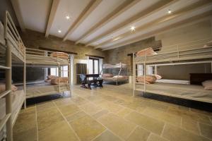 a room with several bunk beds in it at Casalino di Sopra in Tredozio +54 photos