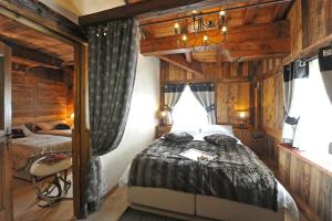 Säng eller sängar i ett rum på Affittacamere Petit Coeur