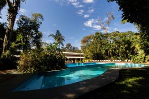 a swimming pool in the middle of a resort at Hotel Sol Cataratas in Puerto Iguazú