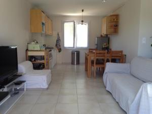 a living room with a couch and a table at Maison Gite Albi in Albi