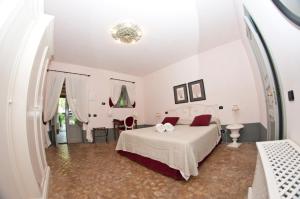 Postel nebo postele na pokoji v ubytování La Salina Hotel Borgo Di Mare