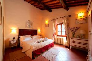 Postel nebo postele na pokoji v ubytování Castello Di Gargonza + 37 fotografií