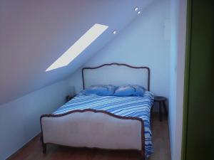 Postel nebo postele na pokoji v ubytování Gîte Lézardrieux