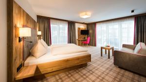Postel nebo postele na pokoji v ubytování Hotel Sendlhof