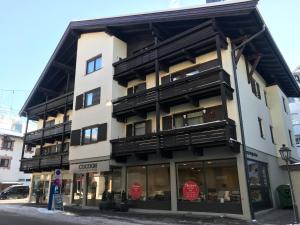 a building with balconies on the side of it at Appartement Central in Kitzbühel