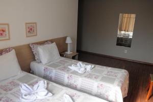 Crigial Hotel客房内的一张或多张床位