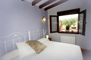 Postel nebo postele na pokoji v ubytování Apartamentos Fermín