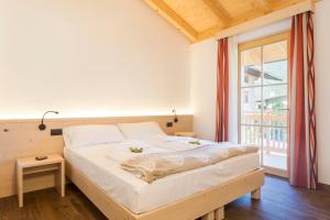 Postel nebo postele na pokoji v ubytování Bio Agritur Le Millemele