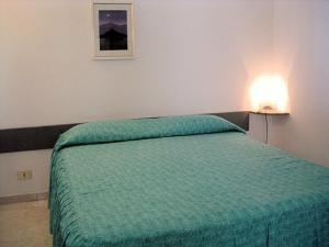 Кровать или кровати в номере BLU MARINE CASA a 10mt dalla SPIAGGIA
