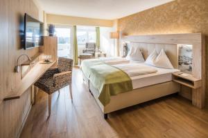 Postel nebo postele na pokoji v ubytování Panorama Hotel Turracher Höhe
