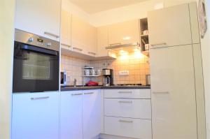 Kuchyň nebo kuchyňský kout v ubytování Jasmina Apartment