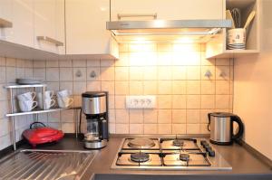 Kuchyň nebo kuchyňský kout v ubytování Jasmina Apartment