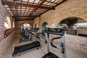 a gym with two treadmills and two ellipticals at Coliseum Beach Hotel All Inclusive in Beberibe