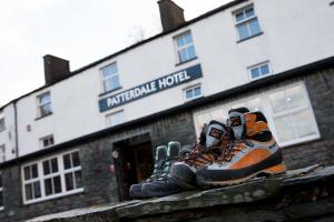 a pair of shoes sitting on the ledge of a building at Patterdale Hotel in Patterdale